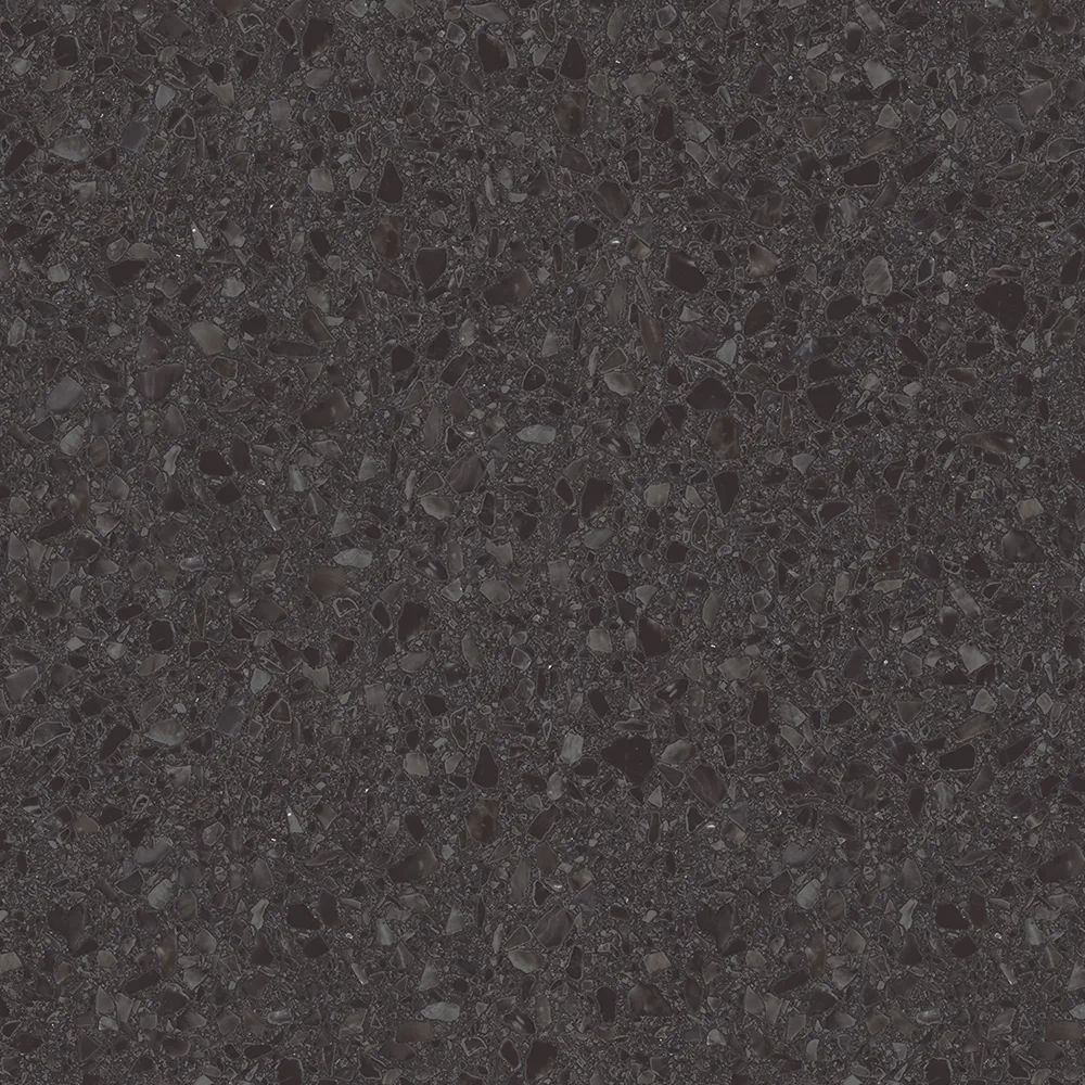 Eine schwarze, strukturierte Oberfläche mit glitzernden, unregelmäßigen Steinpartikeln. Die Oberfläche wirkt elegant und modern, ideal für Badezimmer- oder Küchendesigns.